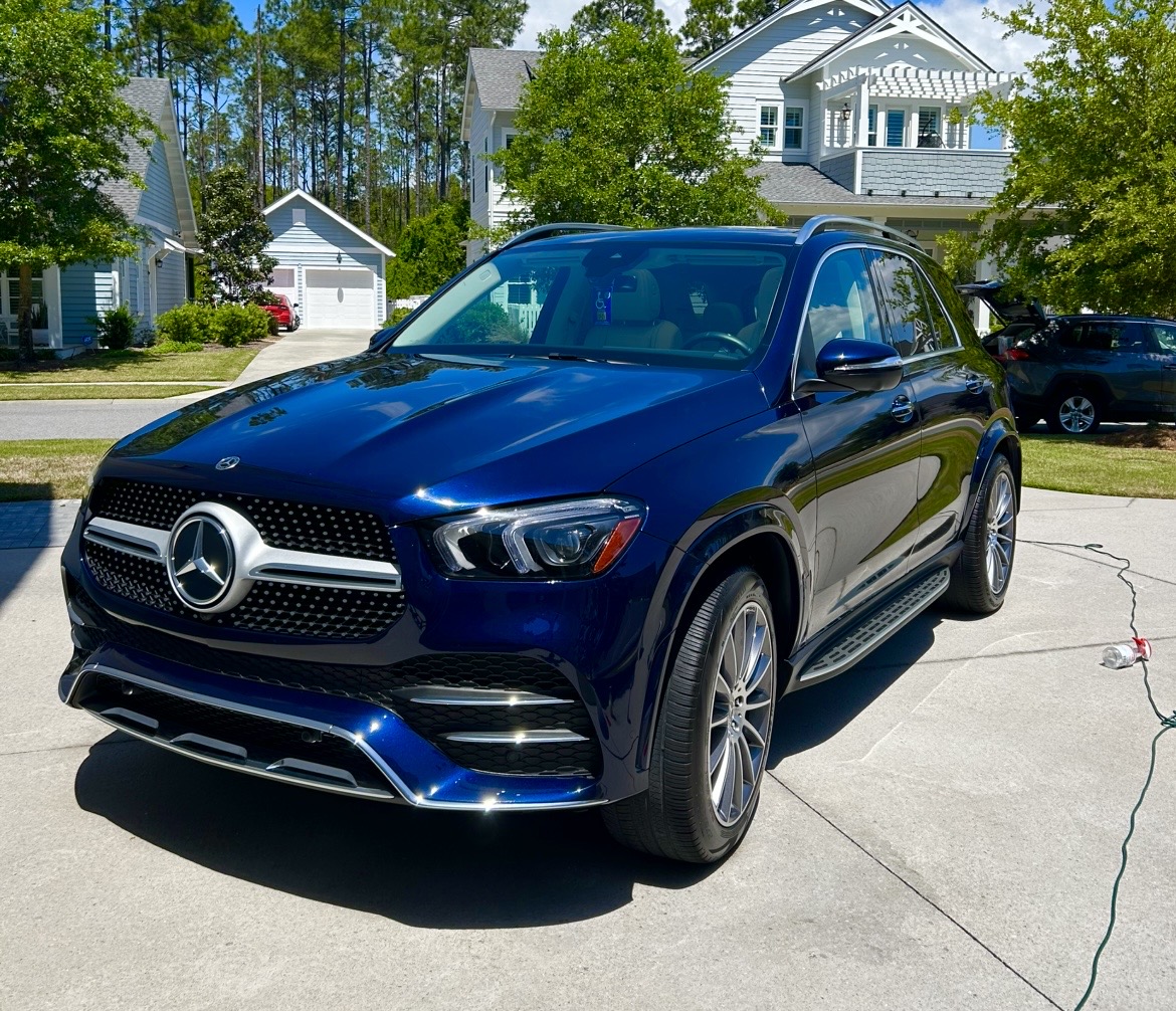 Detailed deep blue Mercedes GLE in driveway